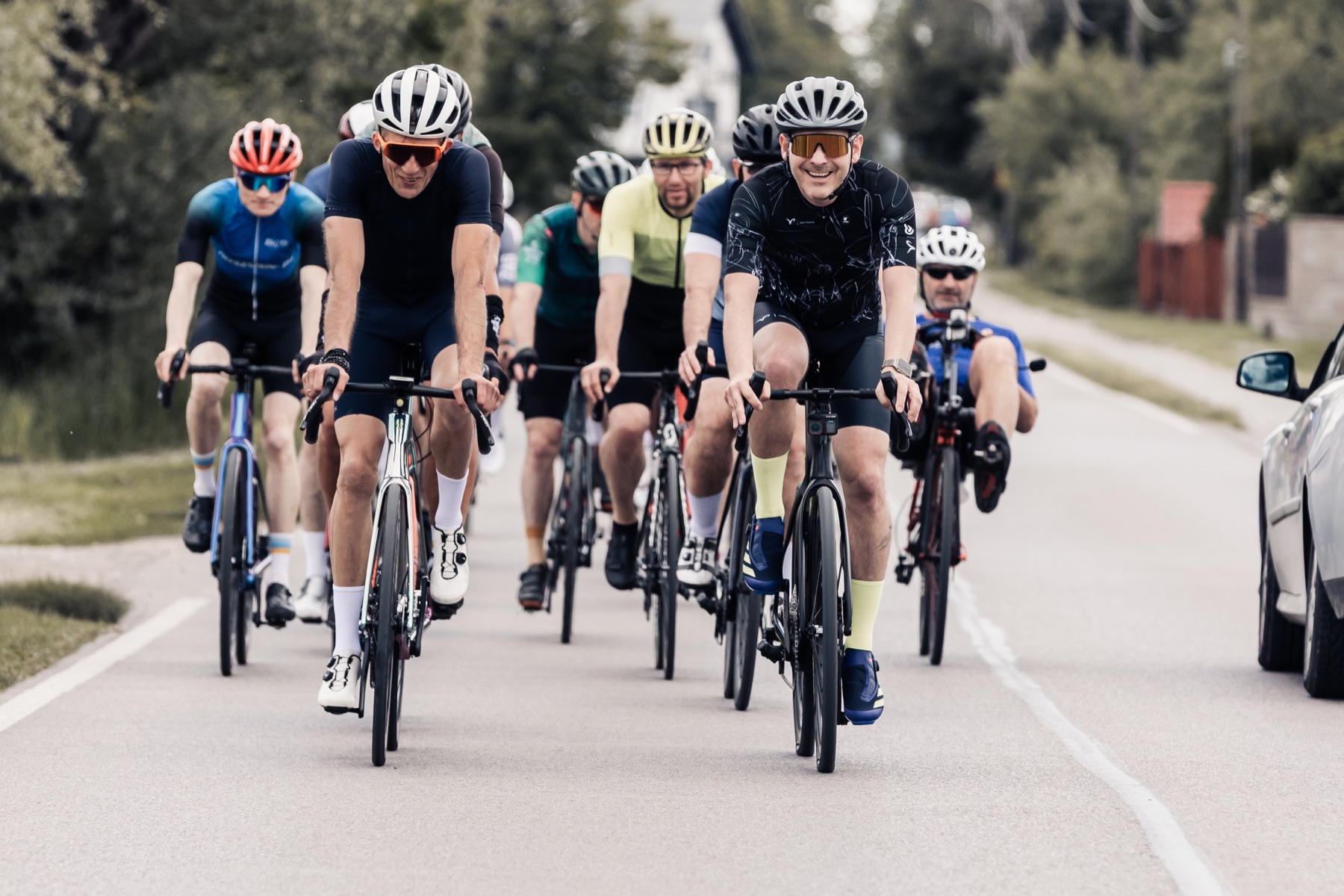 Cycling group riding on a sunny road
