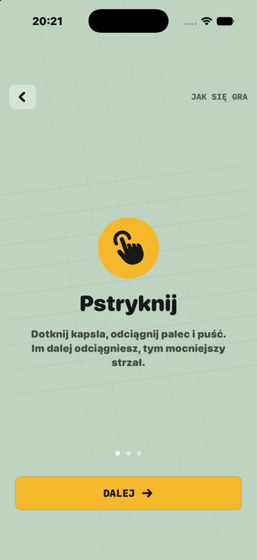 Ekran samouczka z instrukcja pstrykania kapsla.
